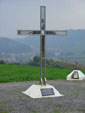 Memorial cross in honour to Gordan Lederer, with a view to Kostajnica and river Una